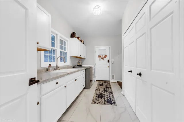 aerial view of a house with table and chairs potted plants