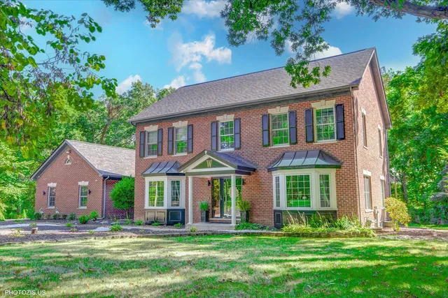 a kitchen with granite countertop white cabinets and stainless steel appliances