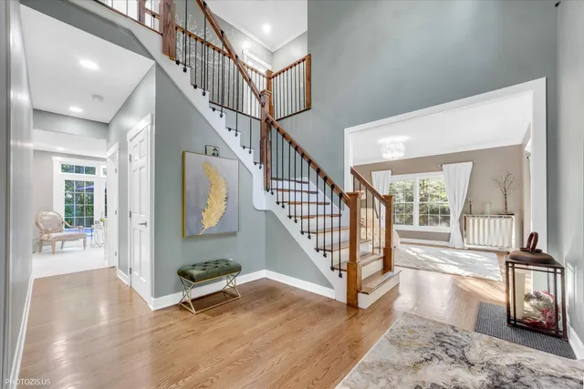 a very nice looking living room with stainless steel appliances furniture a rug and a large window