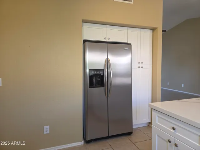 a kitchen with stainless steel appliances a stove a microwave and sink