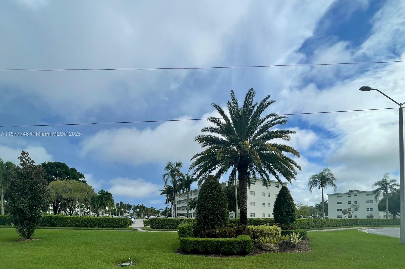 251 Suffolk F, Unit 251 Boca Raton, FL 33434 - Photo 18 of 25 a view of outdoor space with garden