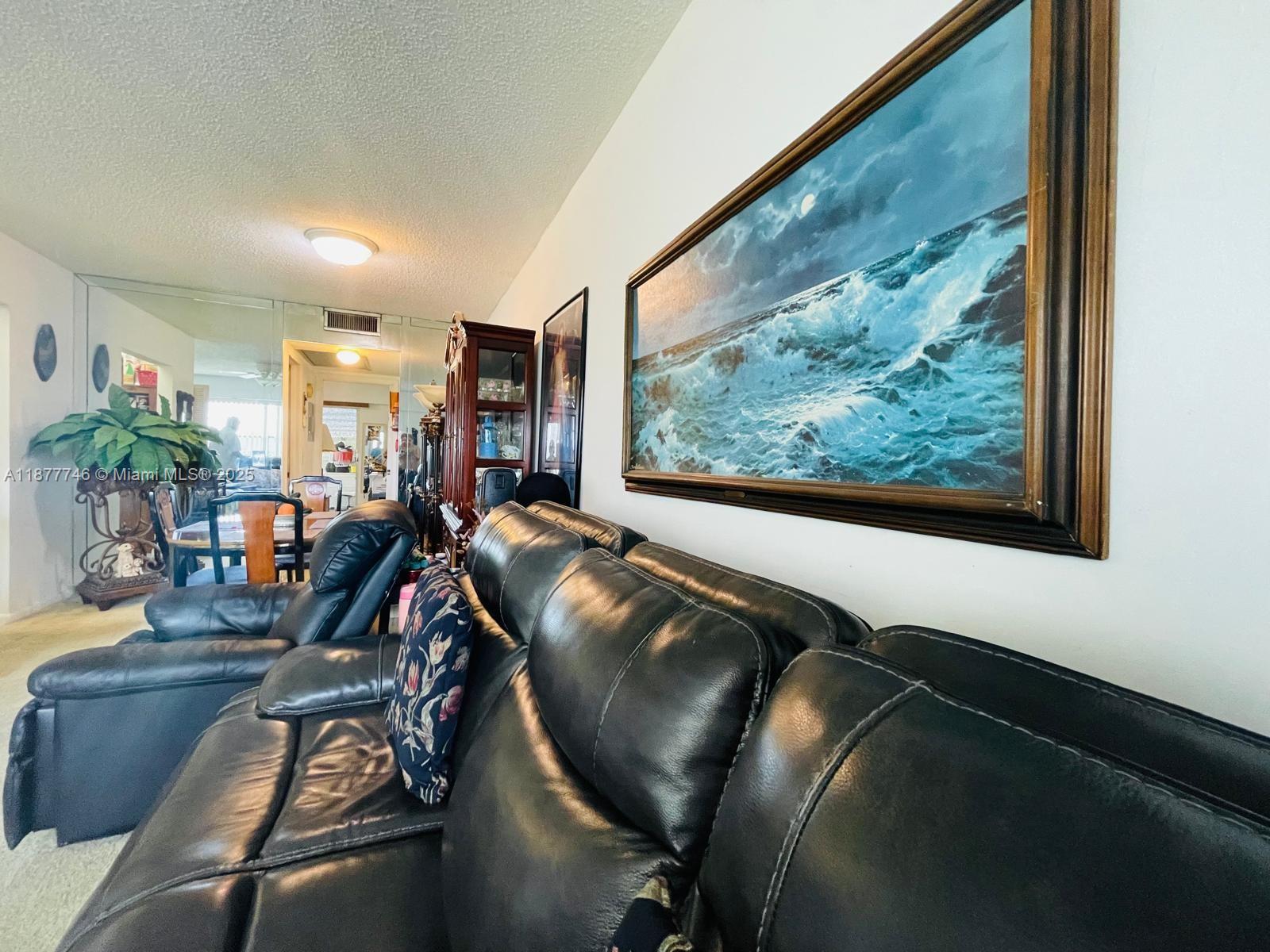 251 Suffolk F, Unit 251 Boca Raton, FL 33434 - Photo 3 of 25 a view of a room with gym equipment