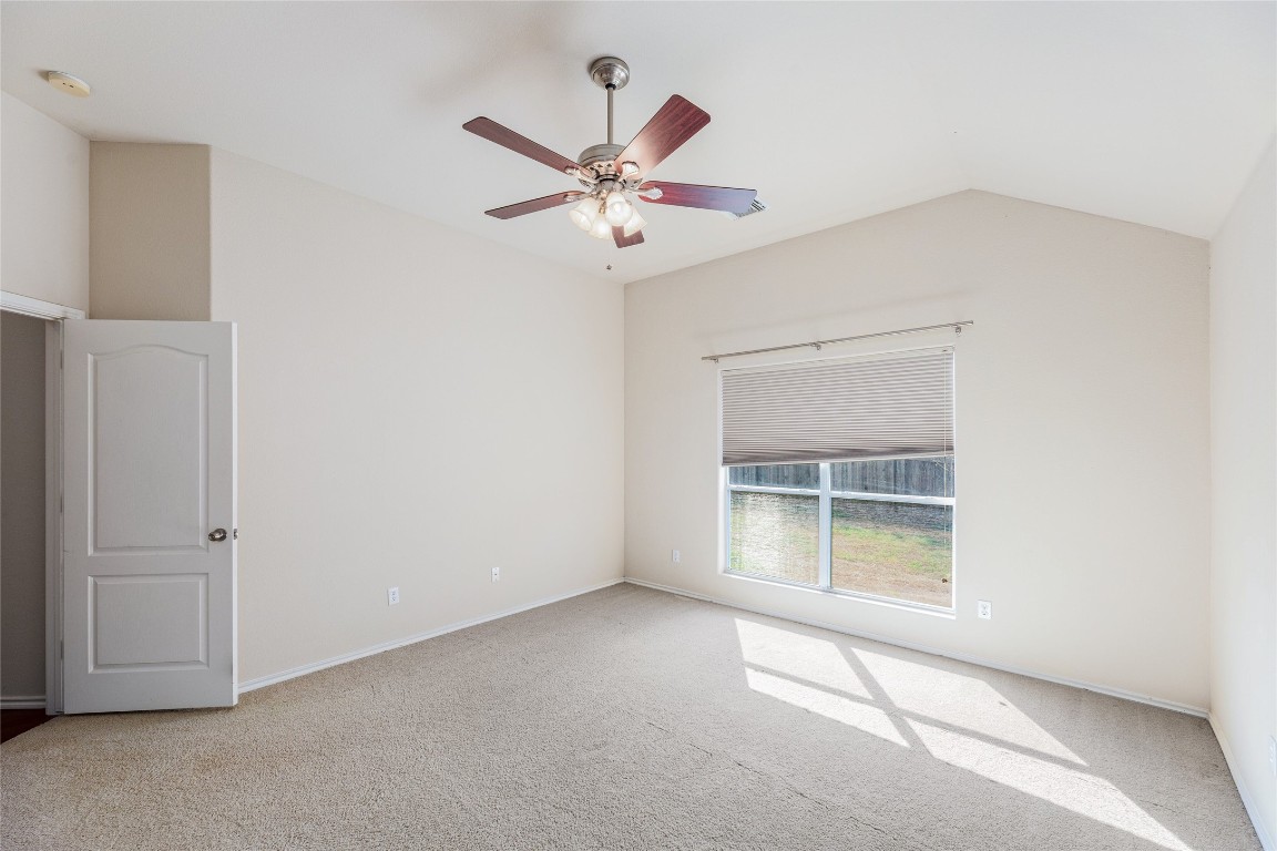 1613 Bowerton Drive Austin, TX 78754 - Photo 15 of 30 an empty room with closet and a ceiling fan