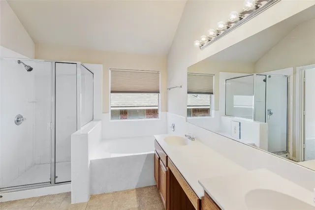 a room with a bed and a large window