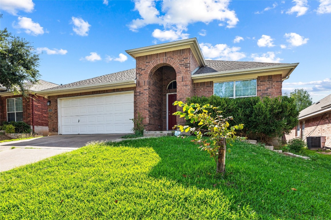 1613 Bowerton Drive Austin, TX 78754 - Photo 4 of 30 a front view of a house with a garden