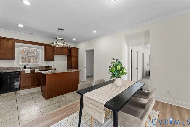 a kitchen with a table and chairs in it