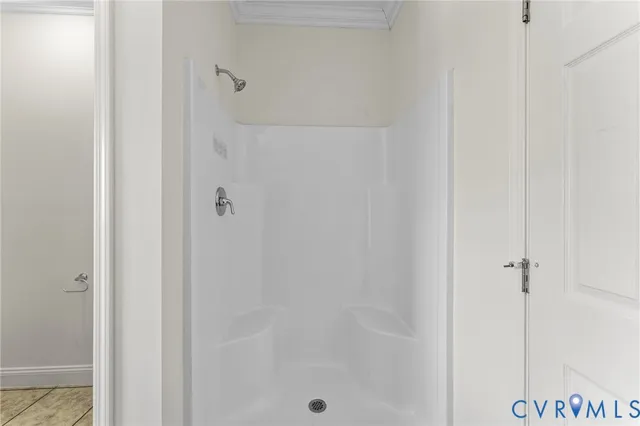 a bathroom with a glass shower door