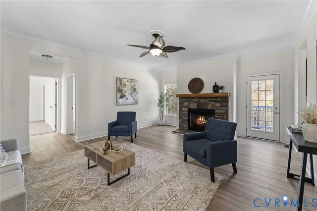 a living room with furniture a fireplace and a table