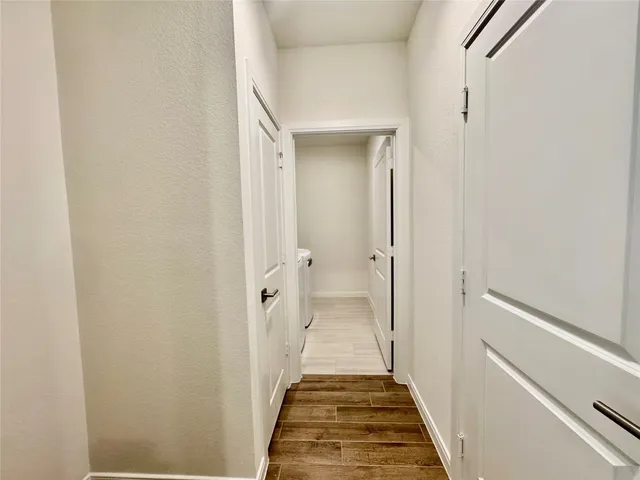 a view of a bathroom from a hallway