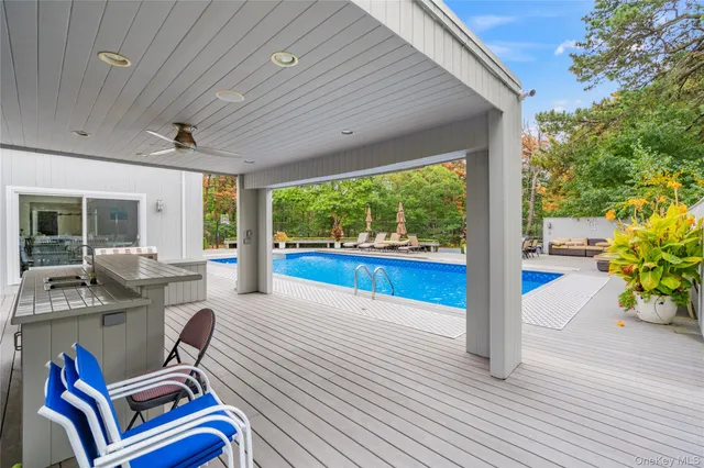 a work room with furniture and a wooden floor