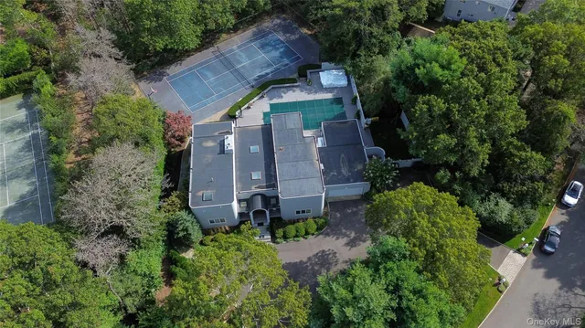 an aerial view of a house with a yard and garden
