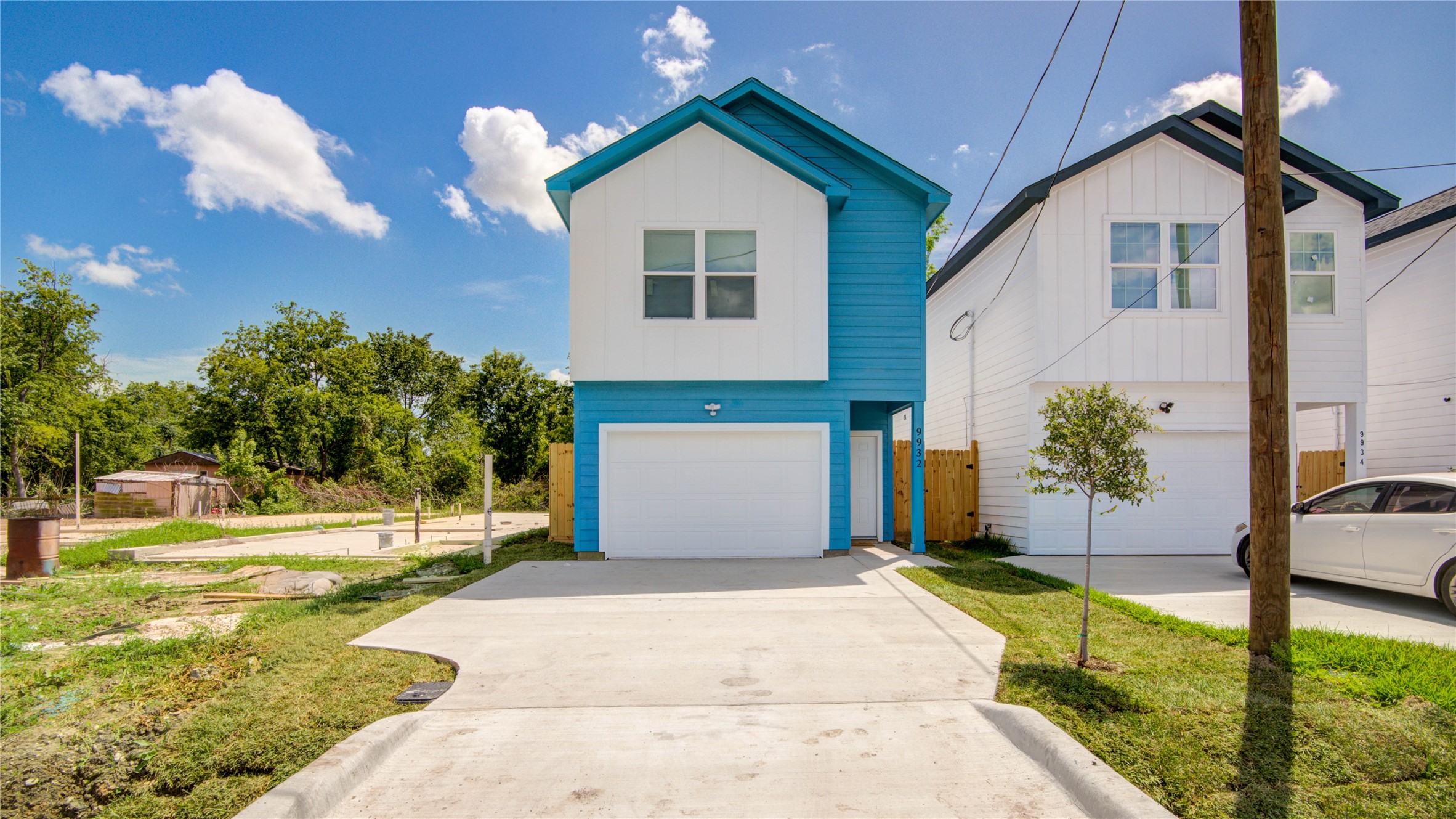 9932 Fillmore Street Houston, TX 77029 - Photo 2 of 27 a front view of a house with a yard and garage