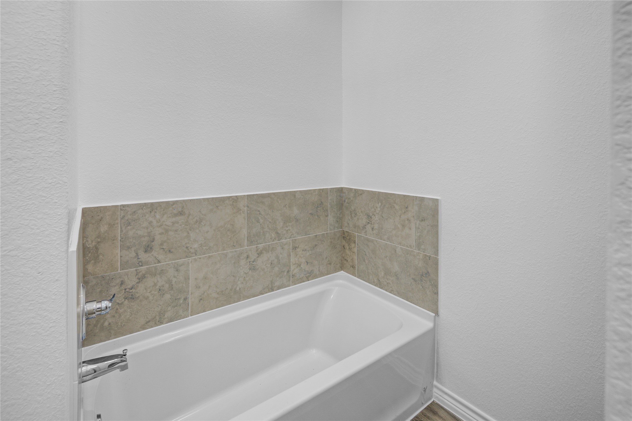 9932 Fillmore Street Houston, TX 77029 - Photo 23 of 27 a bathroom with a bathtub