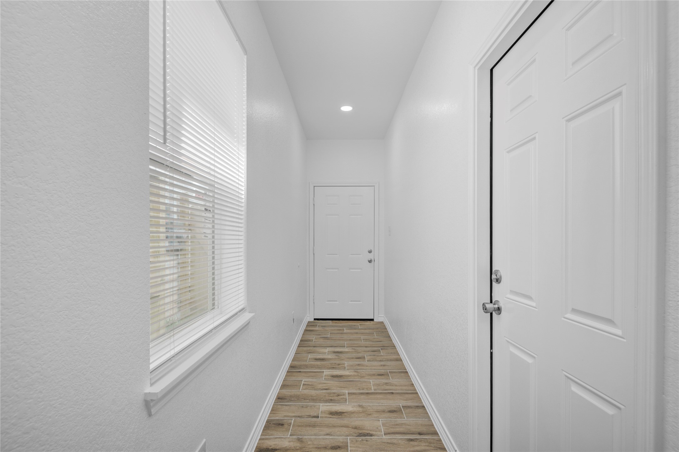 9932 Fillmore Street Houston, TX 77029 - Photo 5 of 27 a view of a hallway with windows