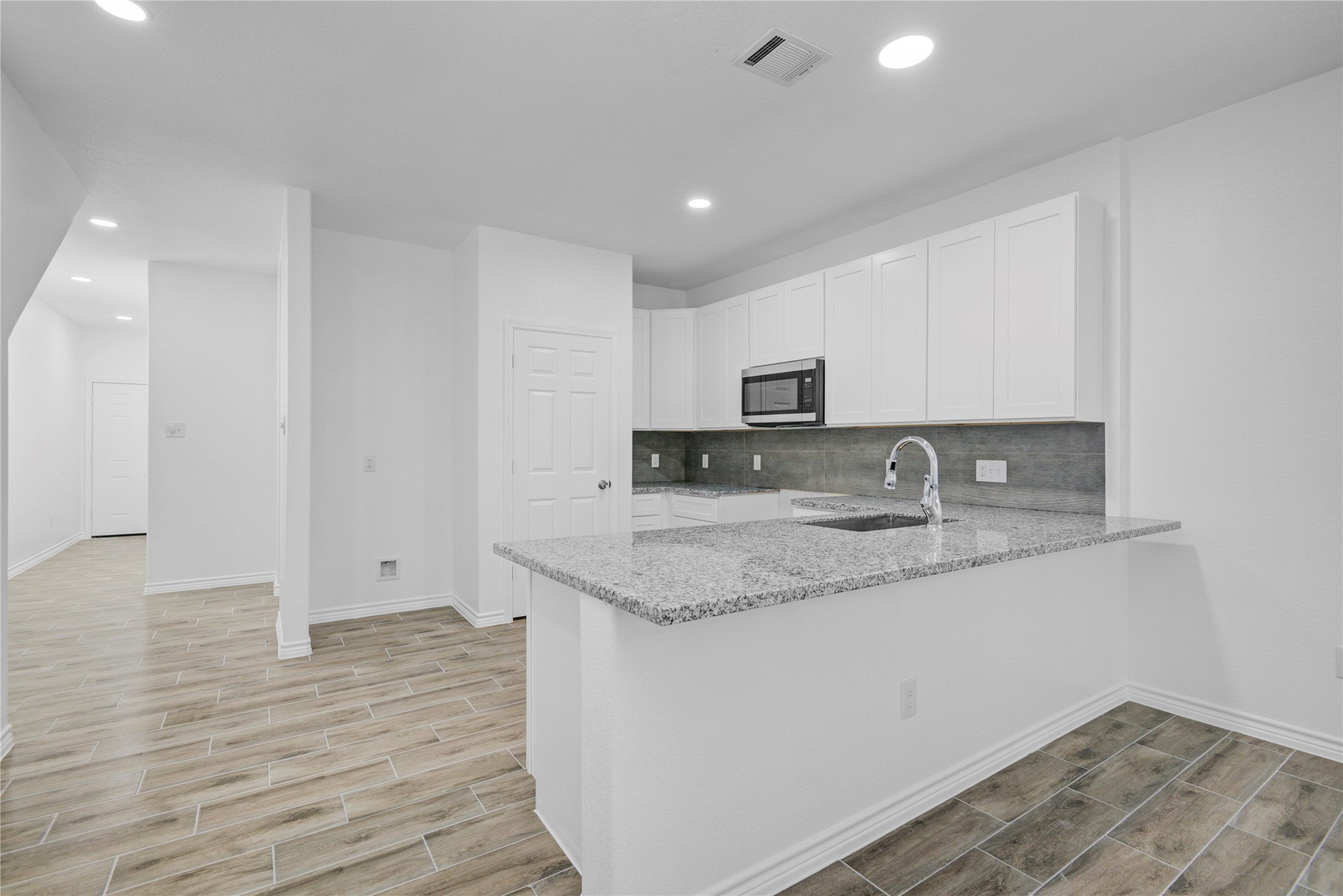 9932 Fillmore Street Houston, TX 77029 - Photo 8 of 27 a kitchen with stainless steel appliances granite countertop a sink stove and cabinets