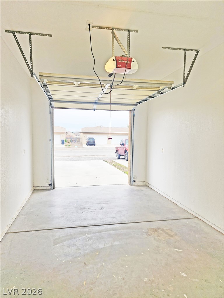 1421 Star Road, Unit 2 Pahrump, NV 89048 - Photo 29 of 33 Garage featuring a garage door opener