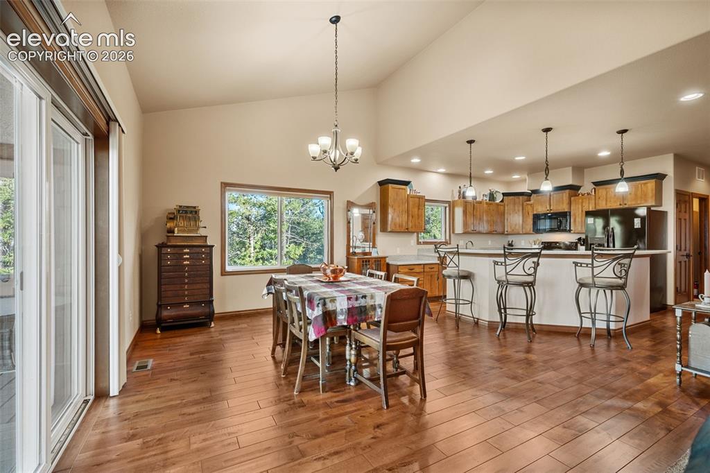 131 Paradiso Road Divide, CO 80814 - Photo 16 of 50 a view of a dining room with furniture window and wooden floor