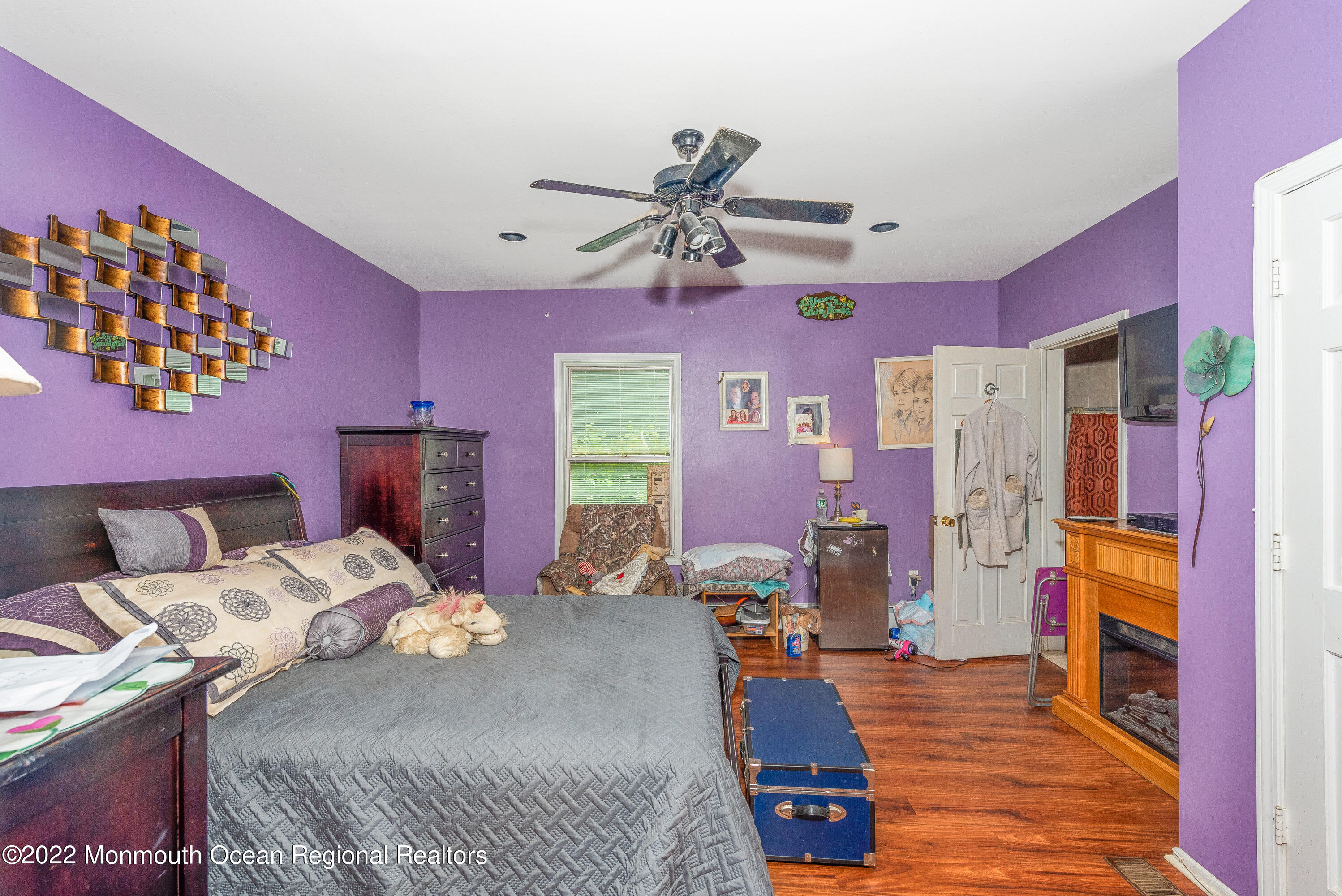 161 Thompson Grove Road Manalapan, NJ 07726 - Photo 17 of 27 a bed room with a bed furniture and a flat screen tv