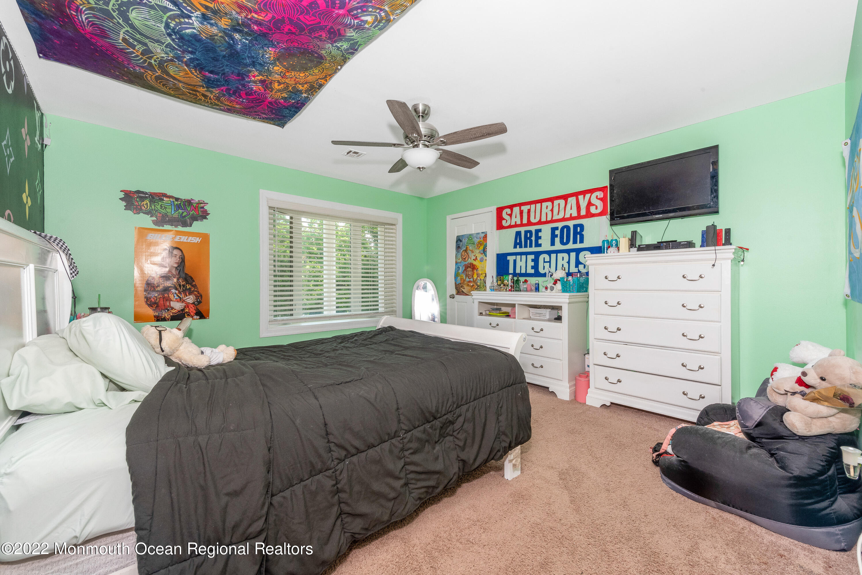 161 Thompson Grove Road Manalapan, NJ 07726 - Photo 18 of 27 a bedroom with a bed and a flat screen tv