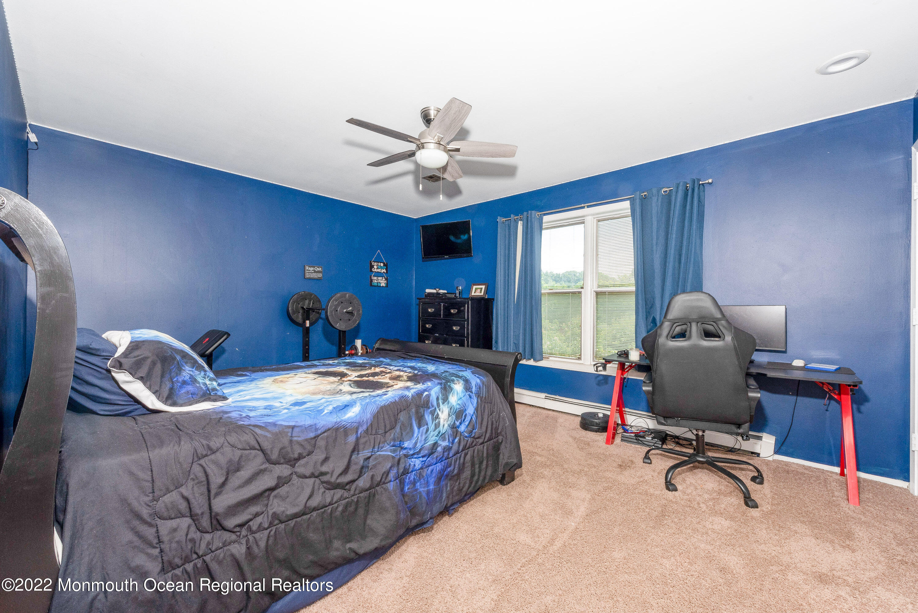161 Thompson Grove Road Manalapan, NJ 07726 - Photo 20 of 27 a bedroom with a bed a desk and chair