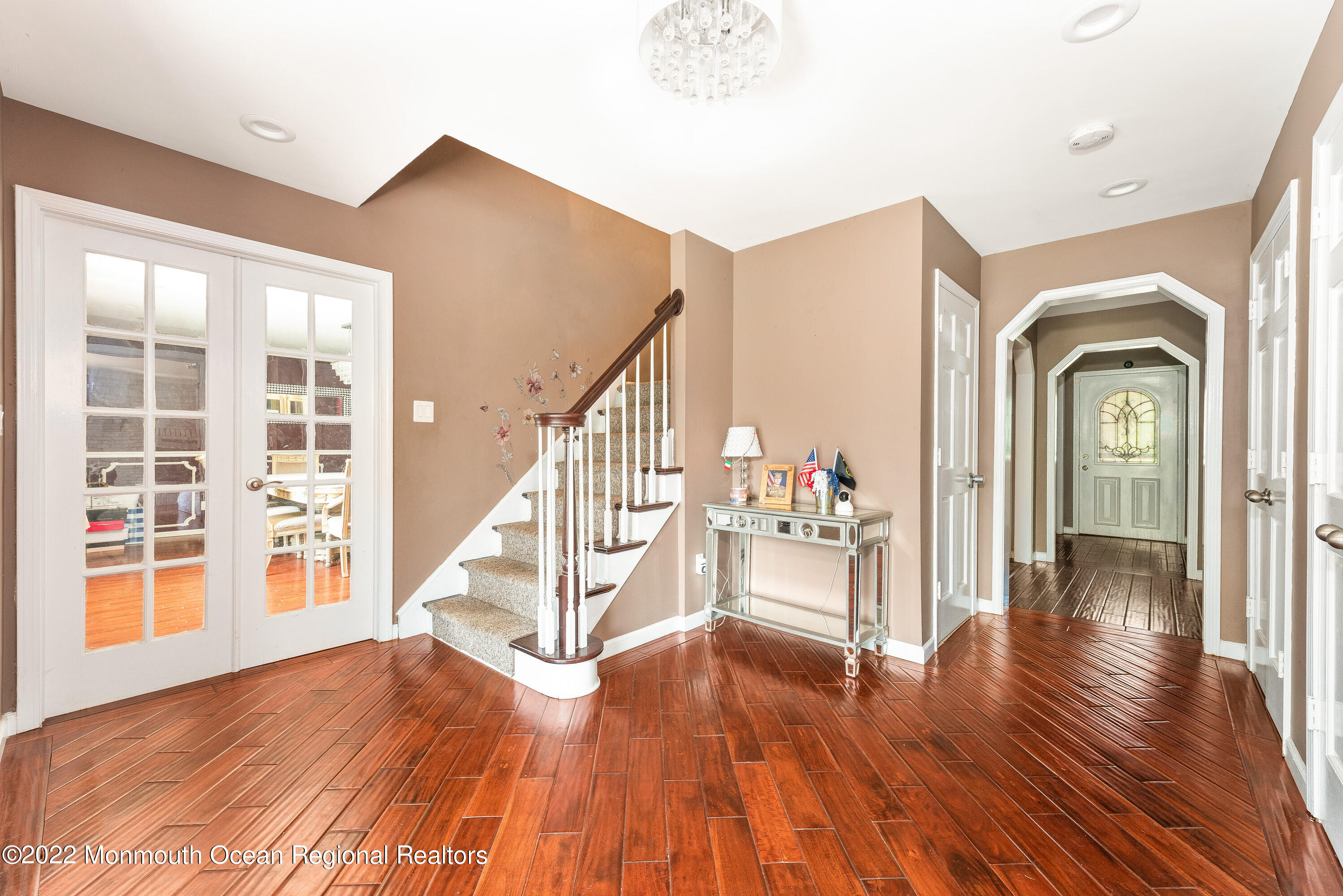 161 Thompson Grove Road Manalapan, NJ 07726 - Photo 2 of 27 a view of staircase with wooden floor and a large window