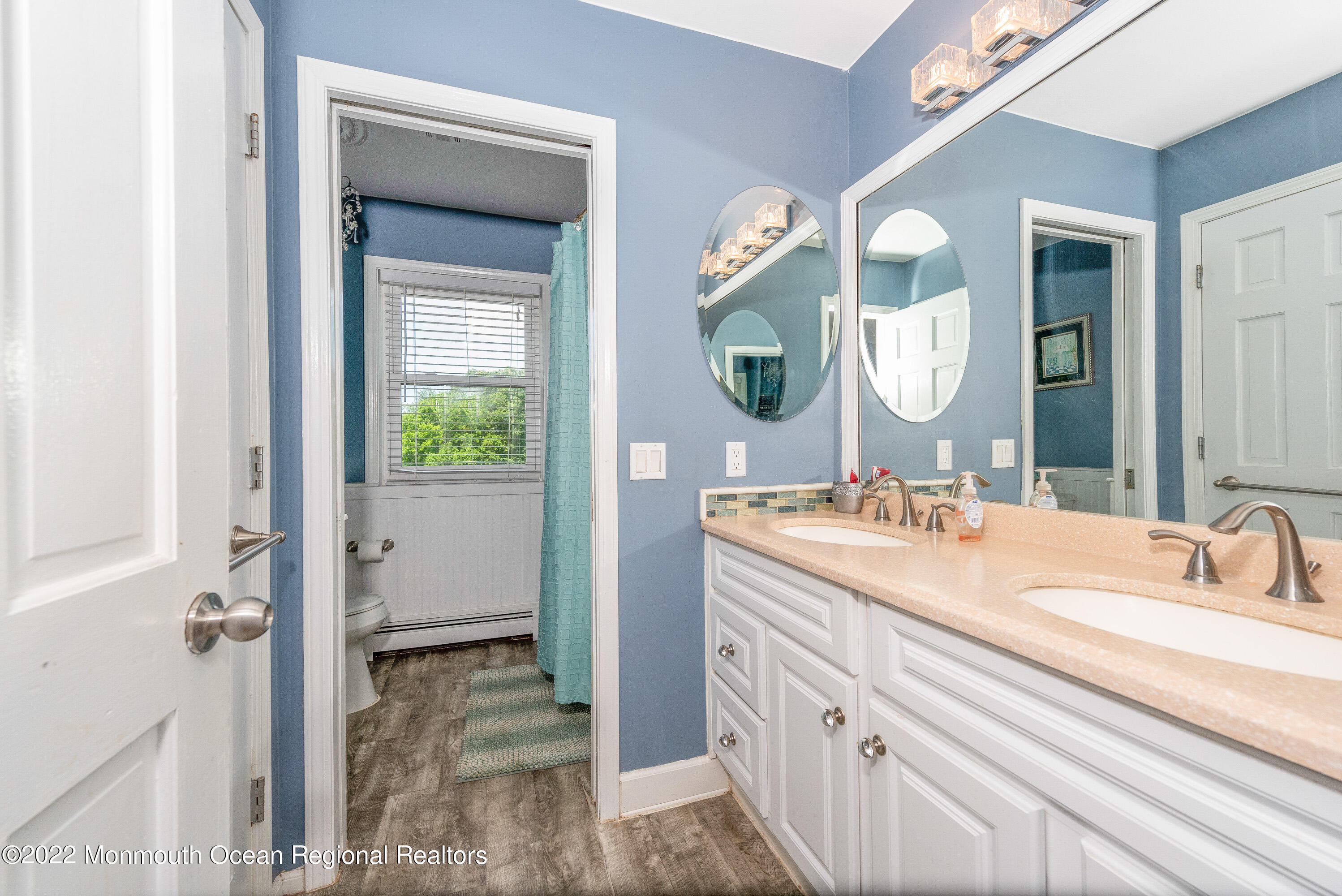 161 Thompson Grove Road Manalapan, NJ 07726 - Photo 21 of 27 a bathroom with a sink vanity and a mirror