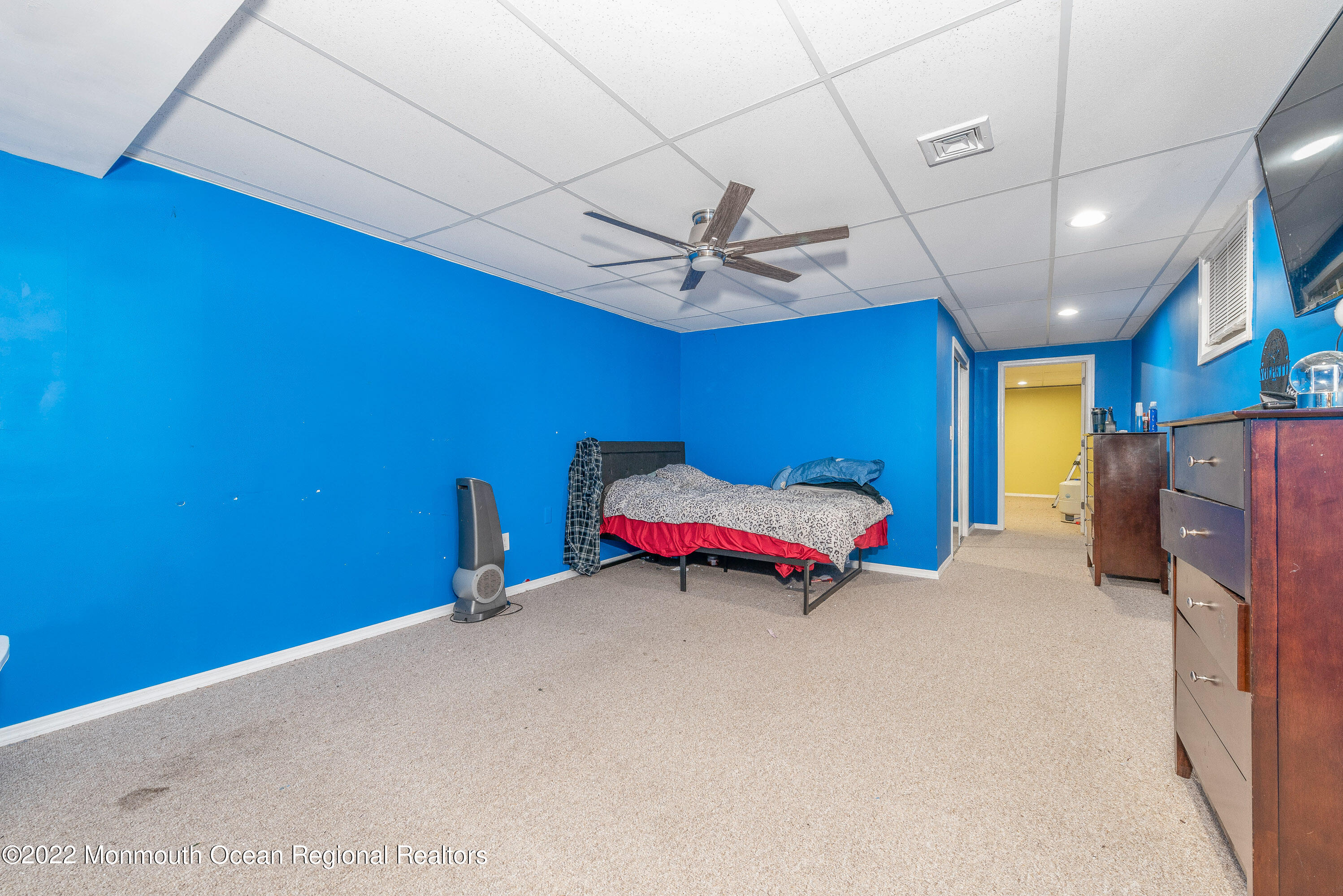 161 Thompson Grove Road Manalapan, NJ 07726 - Photo 22 of 27 a room with a bed and a ceiling fan