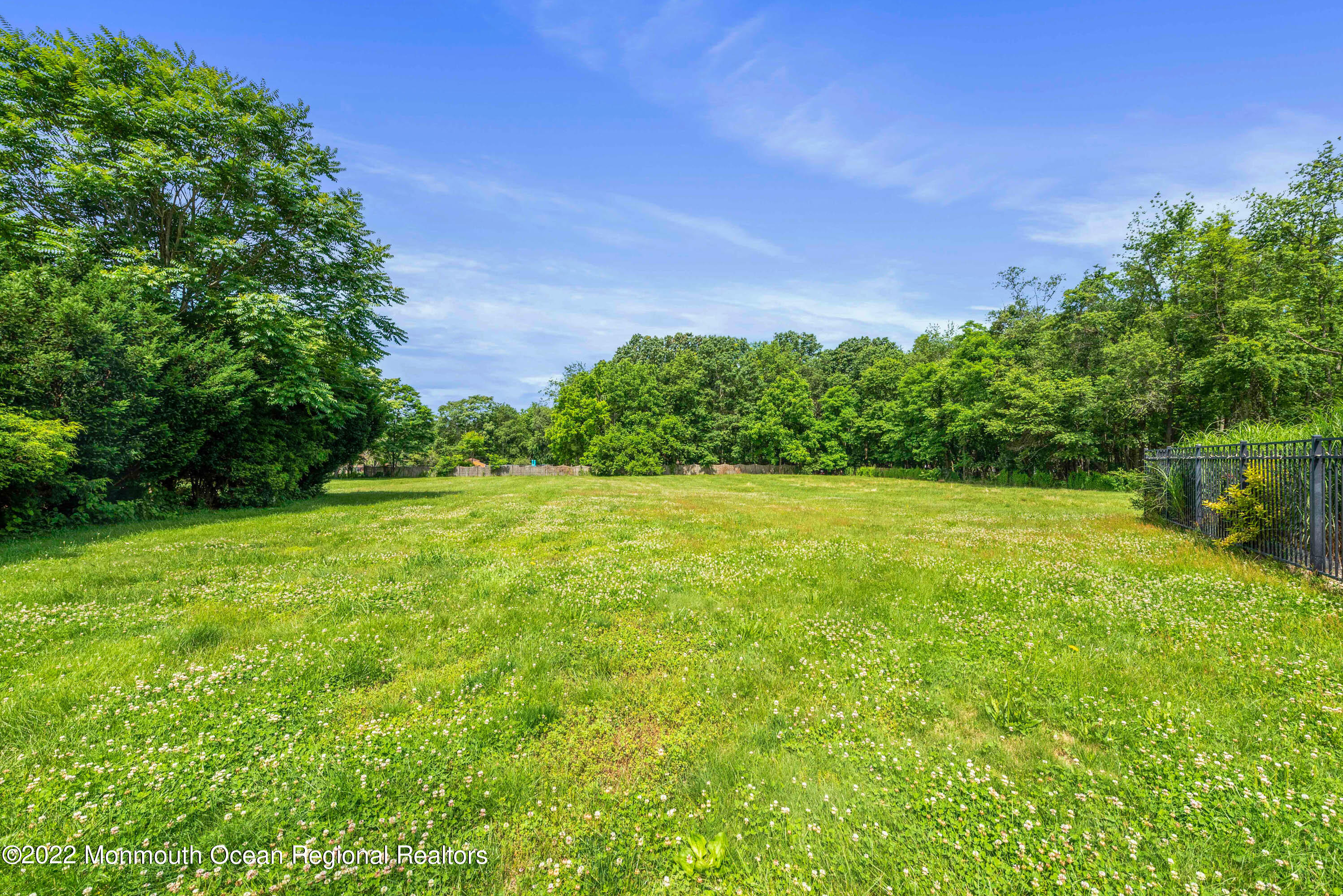 161 Thompson Grove Road Manalapan, NJ 07726 - Photo 27 of 27 a view of yard with swimming pool and green space