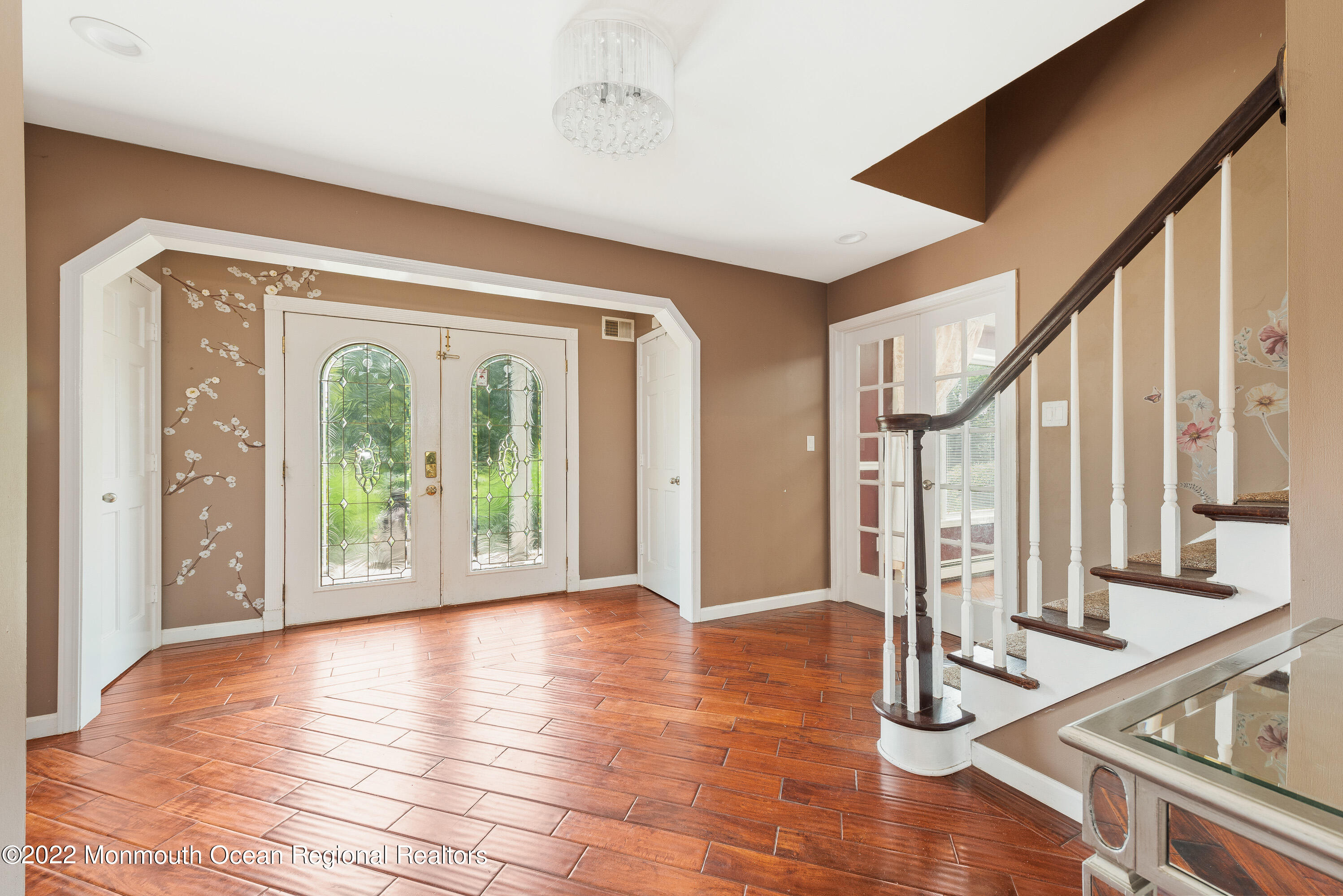 161 Thompson Grove Road Manalapan, NJ 07726 - Photo 3 of 27 a view of an entryway with wooden floor and windows