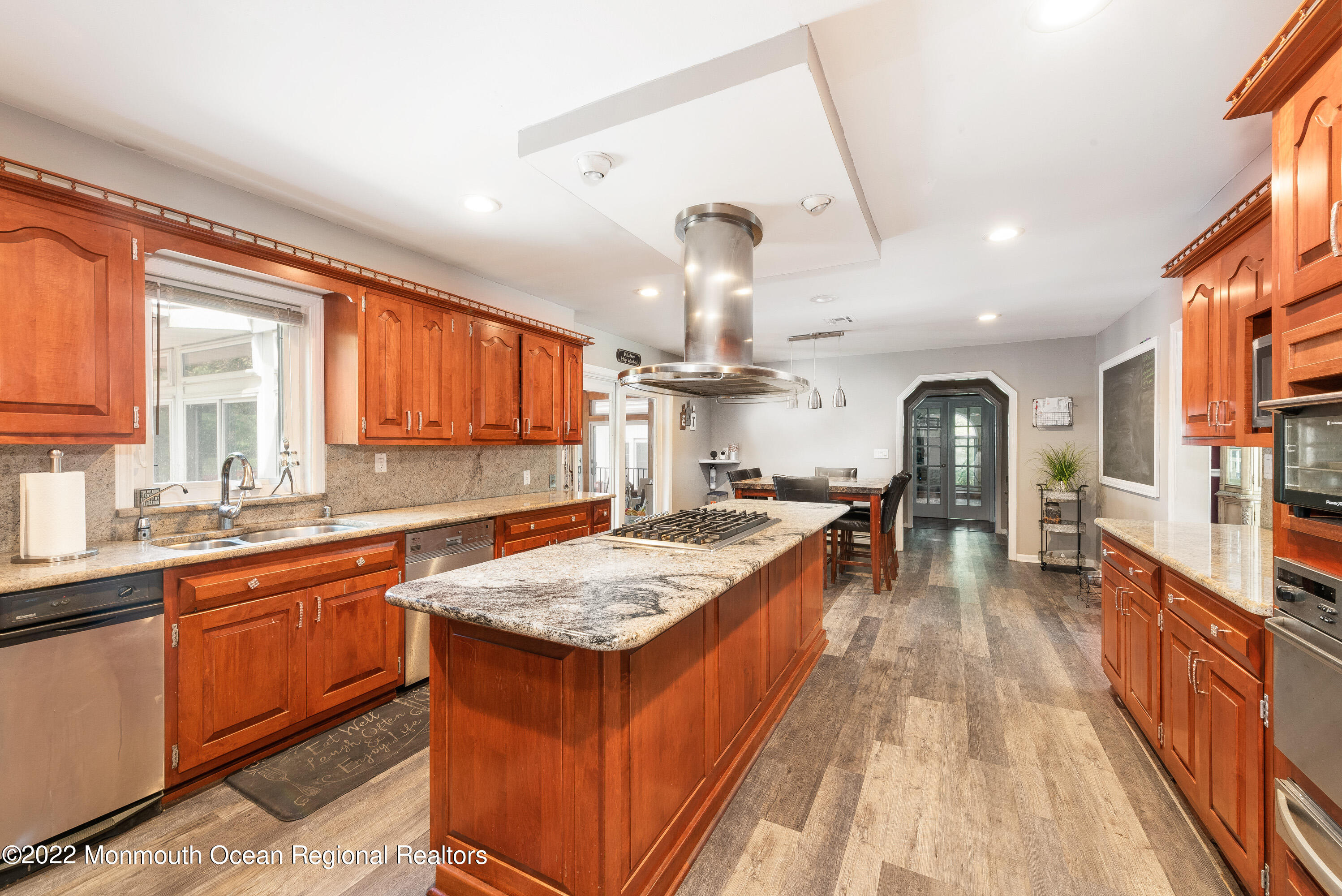 161 Thompson Grove Road Manalapan, NJ 07726 - Photo 4 of 27 a kitchen with a stove a sink dishwasher and a refrigerator with wooden floor