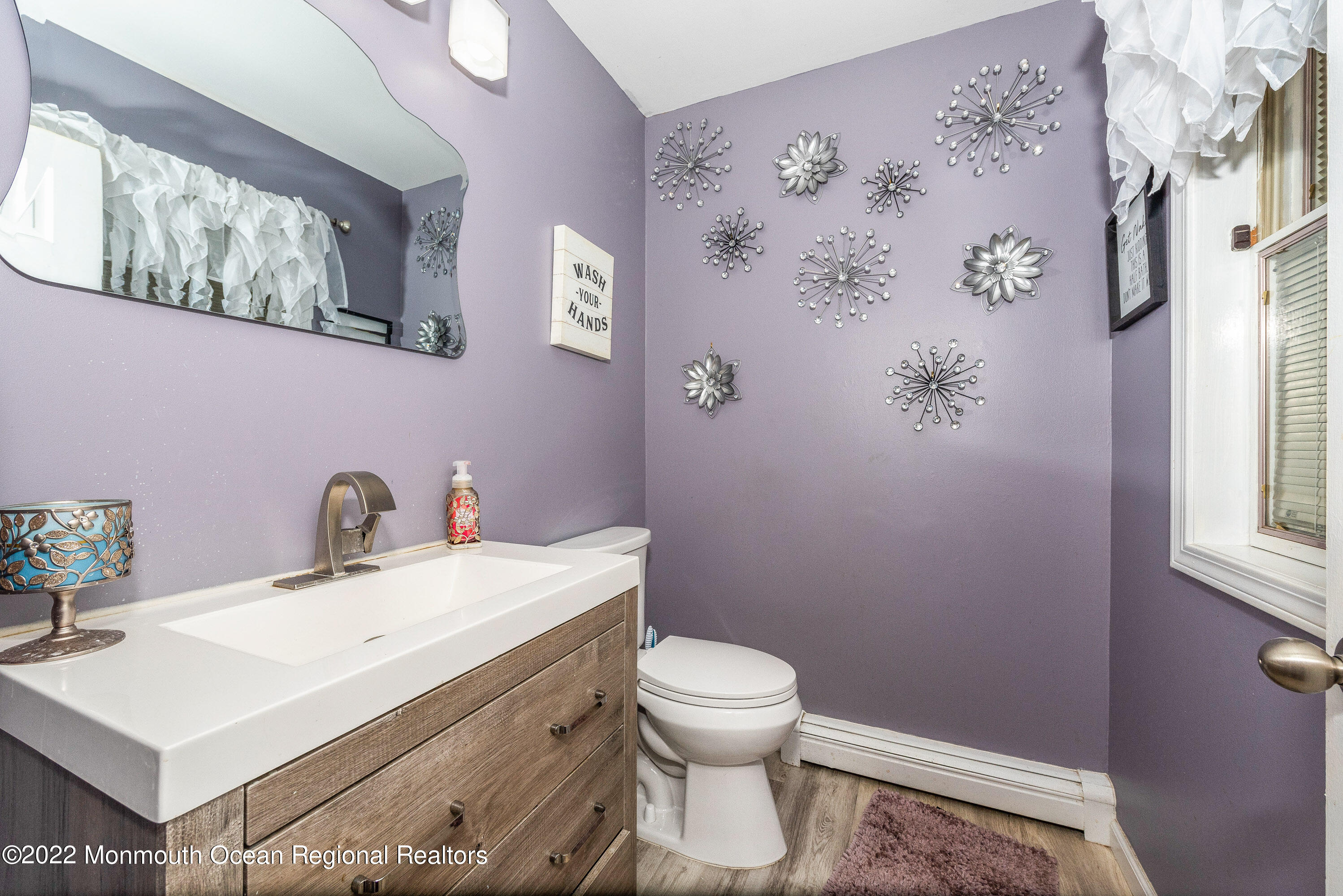 161 Thompson Grove Road Manalapan, NJ 07726 - Photo 9 of 27 a bathroom with a sink mirror vanity and toilet