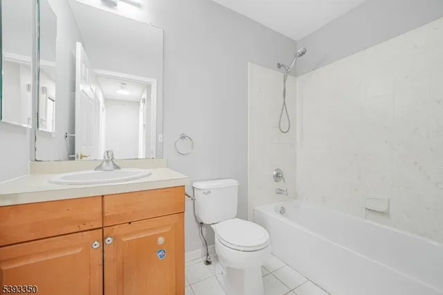 a bedroom with a large bed and a flat screen tv