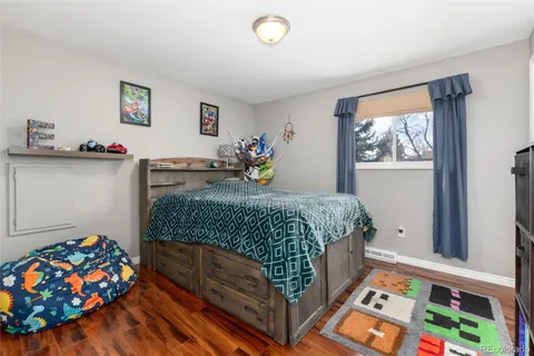 a bedroom with bed and a window