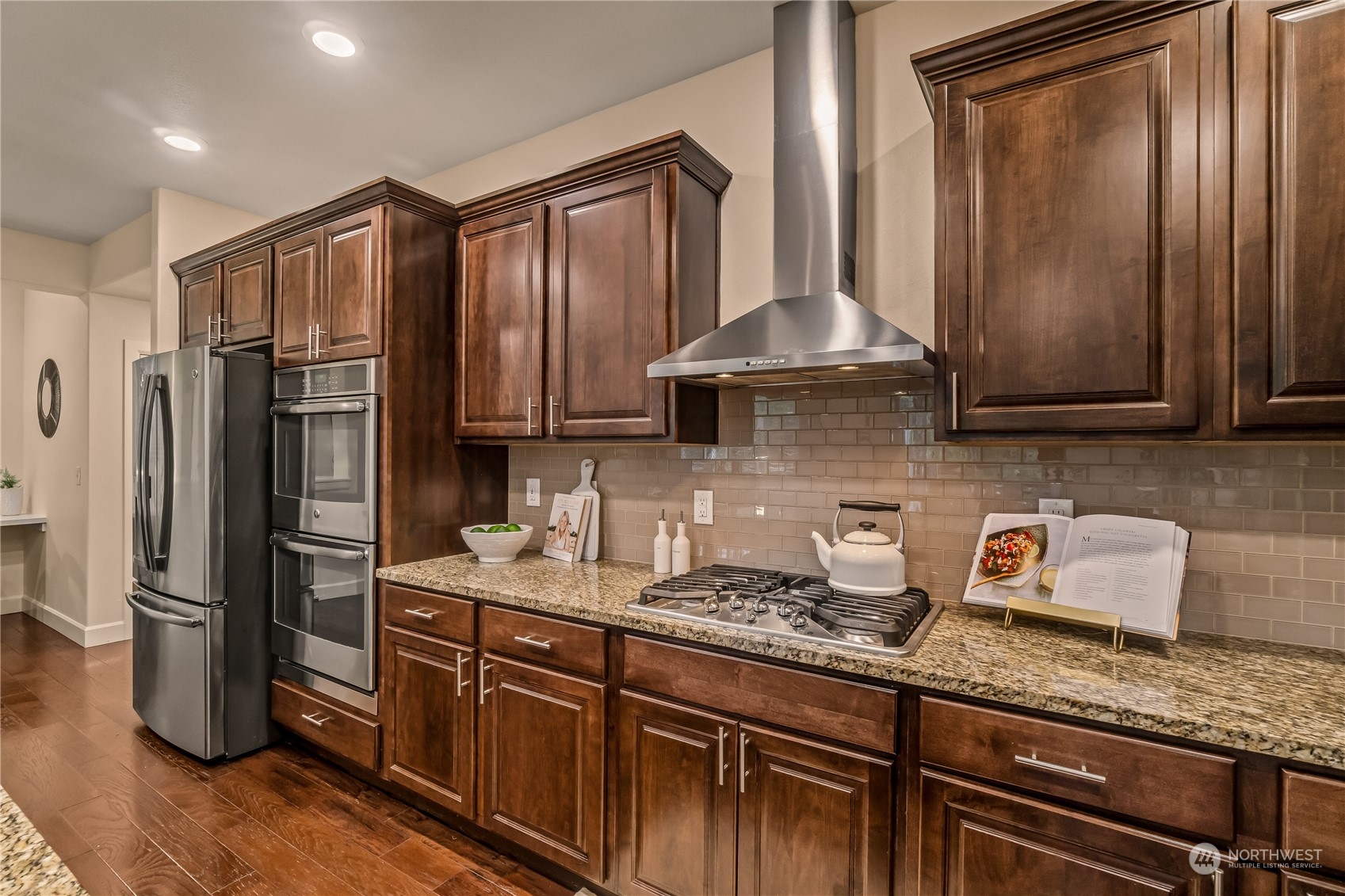 17514 39th Avenue Southeast Bothell, WA 98012 - Photo 14 of 40 a kitchen with stainless steel appliances granite countertop a refrigerator sink and stove