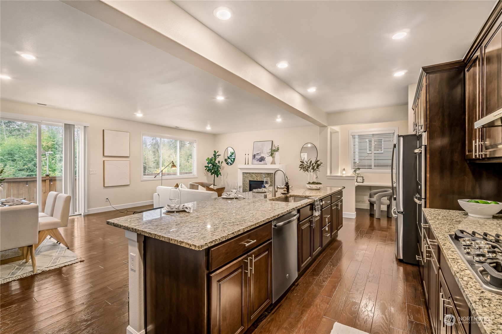 17514 39th Avenue Southeast Bothell, WA 98012 - Photo 16 of 40 a kitchen with stainless steel appliances granite countertop a stove oven and a refrigerator with white cabinets