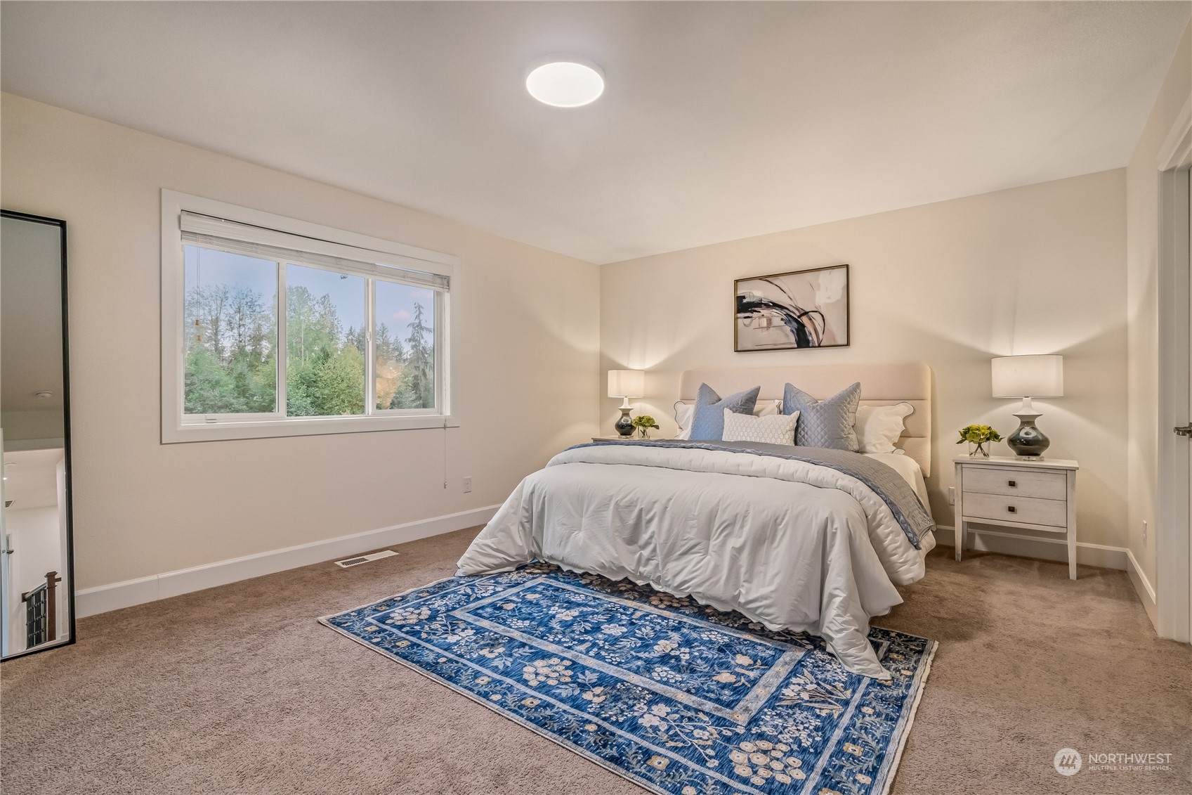 17514 39th Avenue Southeast Bothell, WA 98012 - Photo 20 of 40 a bedroom with a large bed and a window