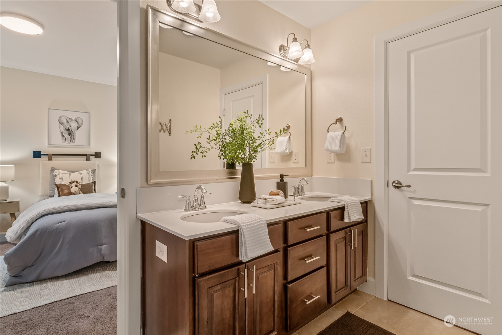 17514 39th Avenue Southeast Bothell, WA 98012 - Photo 23 of 40 a en suite bathroom with a double vanity sink a mirror and a