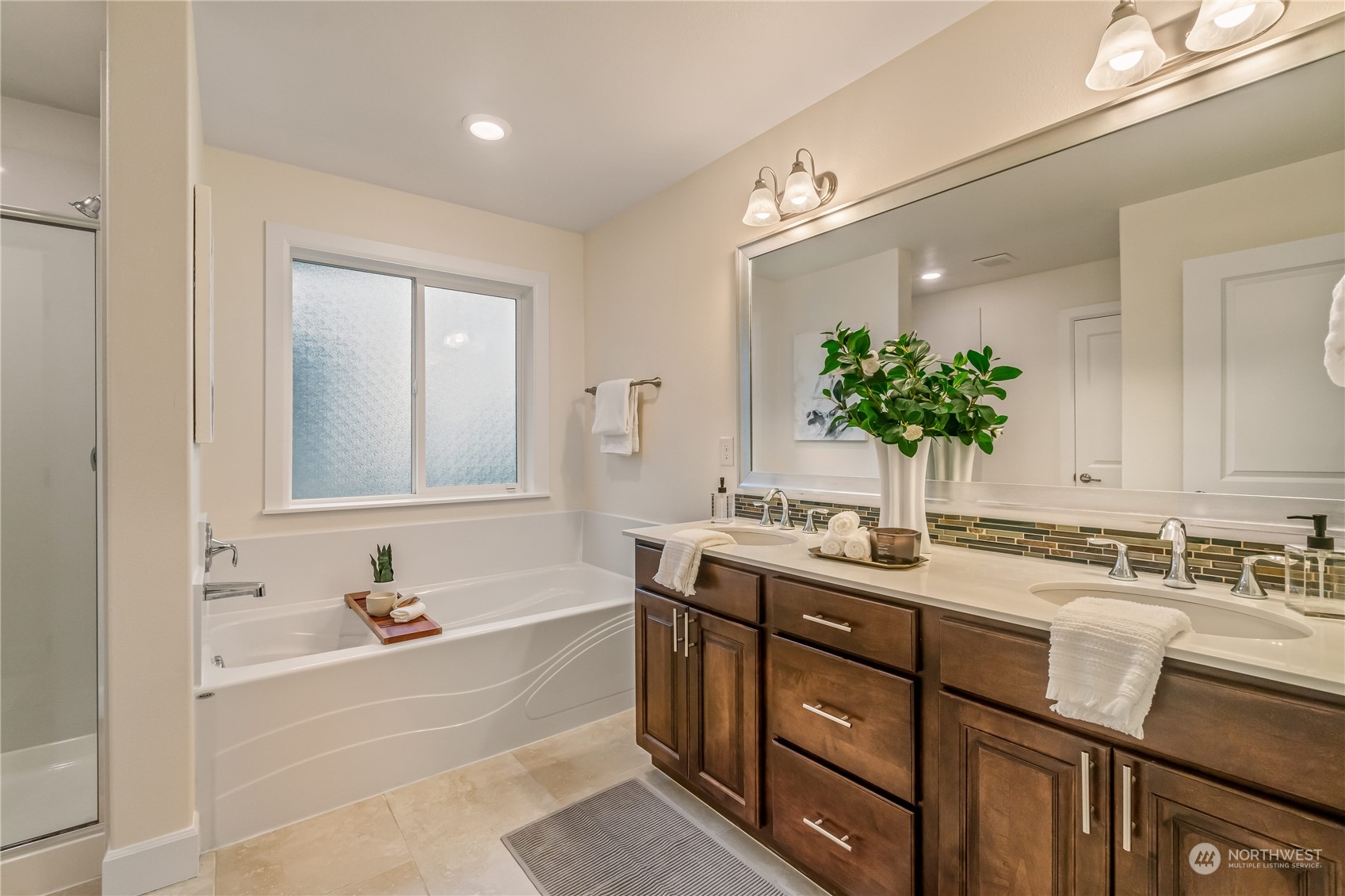 17514 39th Avenue Southeast Bothell, WA 98012 - Photo 25 of 40 a bathroom with a tub sink and mirror