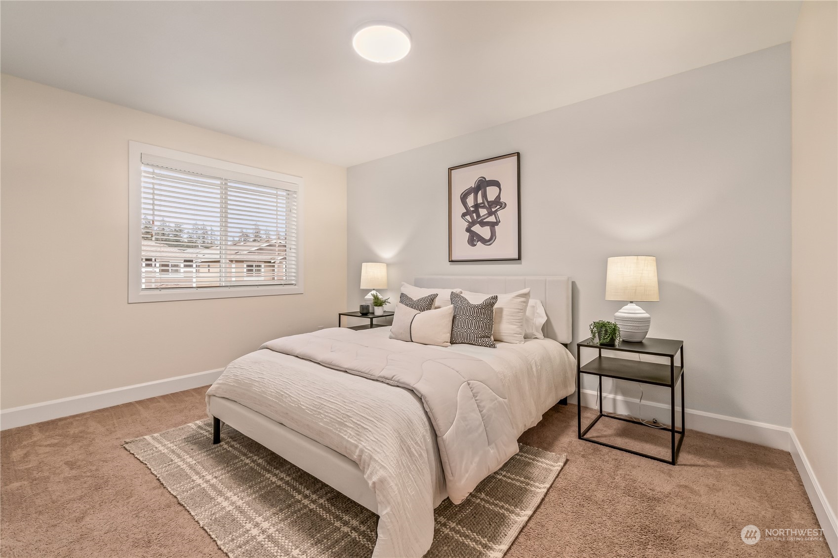 17514 39th Avenue Southeast Bothell, WA 98012 - Photo 27 of 40 a bedroom with a bed and a lamp on table