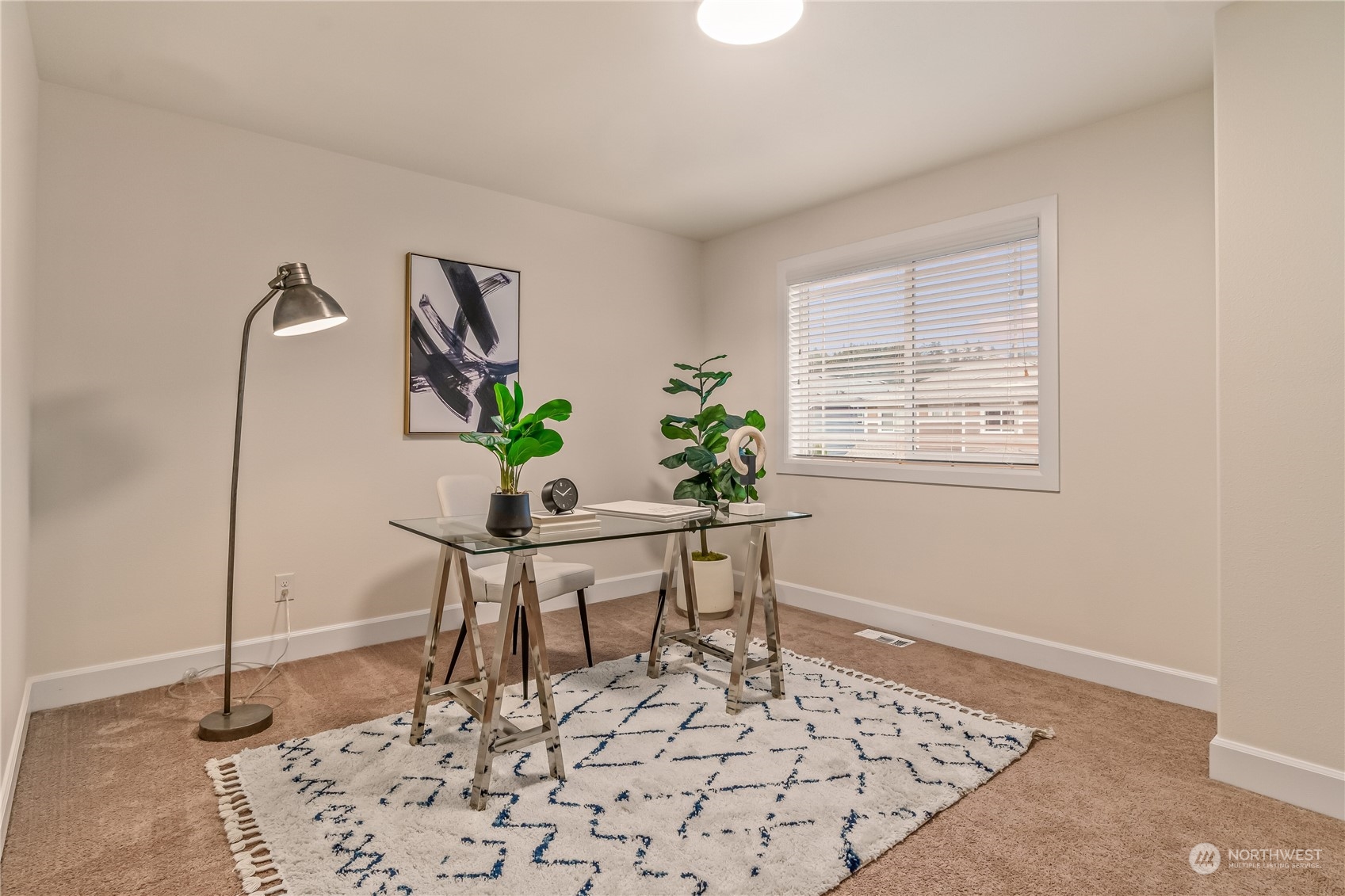 17514 39th Avenue Southeast Bothell, WA 98012 - Photo 29 of 40 a view of a workspace room with wooden floor and a potted plant