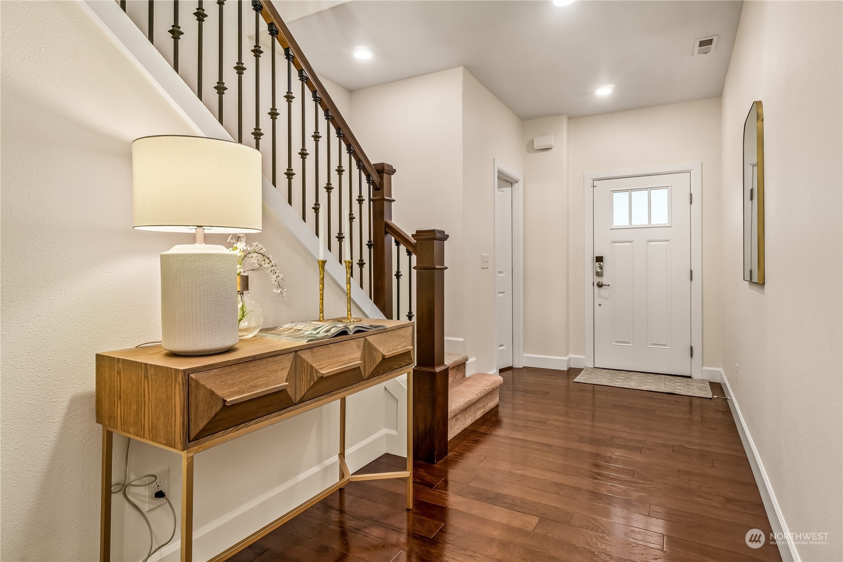 17514 39th Avenue Southeast Bothell, WA 98012 - Photo 3 of 40 a view of a hallway with wooden floor and staircase