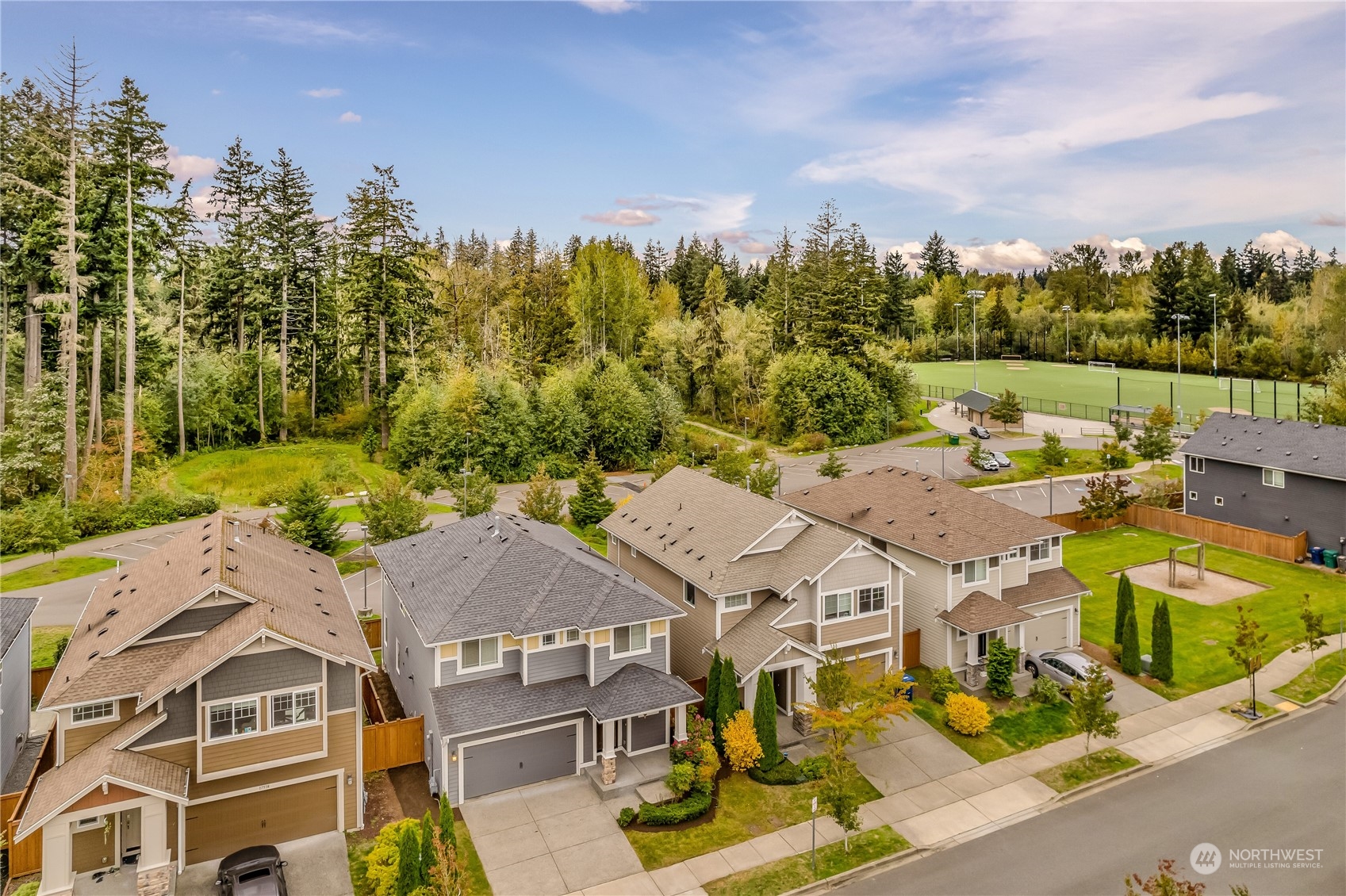 17514 39th Avenue Southeast Bothell, WA 98012 - Photo 36 of 40 an aerial view of a residential houses with yard and mountain view in back