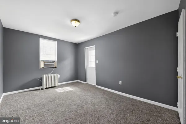 a view of an empty room and window