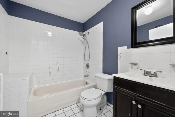a bathroom with a sink a toilet and a bathtub
