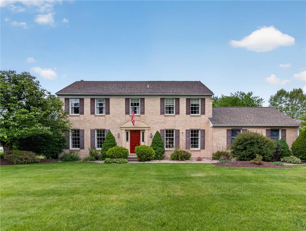 853 Lahr Road Nazareth, PA 18064 - Photo 1 of 29 A classic brick exterior, complete with dark shutters, greets guests with a bright red entry door.