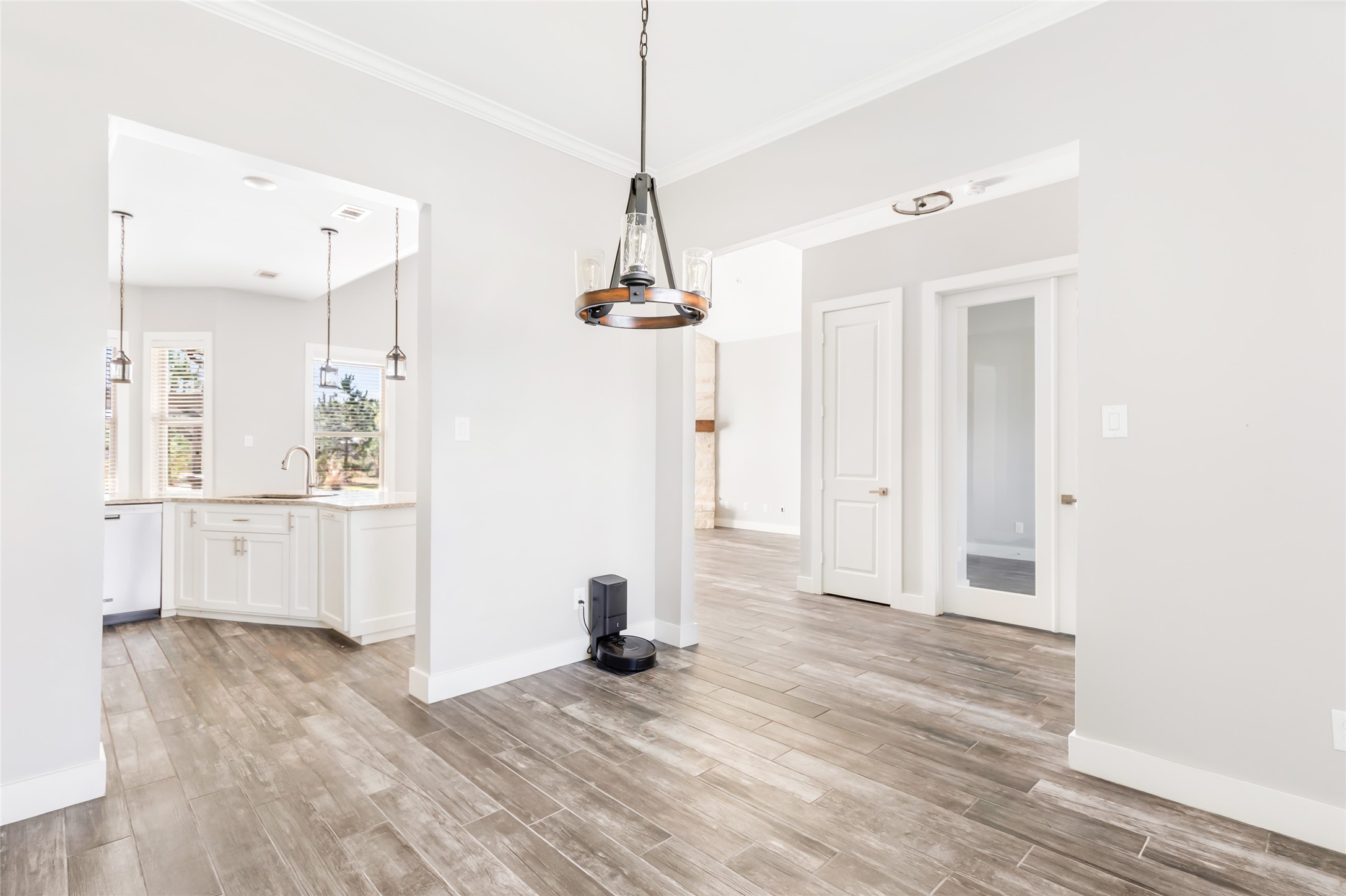 9006 Water Buck Lane Conroe, TX 77303 - Photo 27 of 48 a view of empty room with wooden floor and window