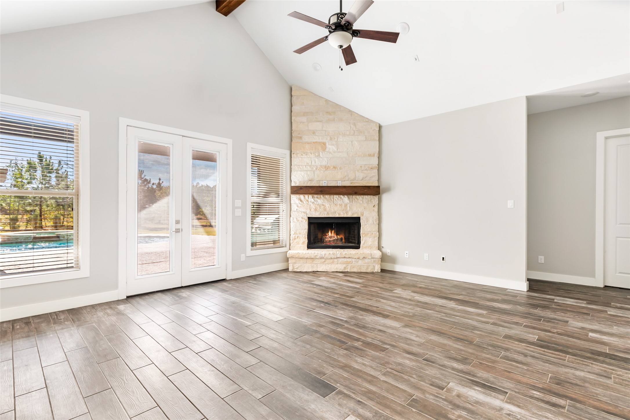 9006 Water Buck Lane Conroe, TX 77303 - Photo 28 of 48 a view of an empty room with wooden floor and a window