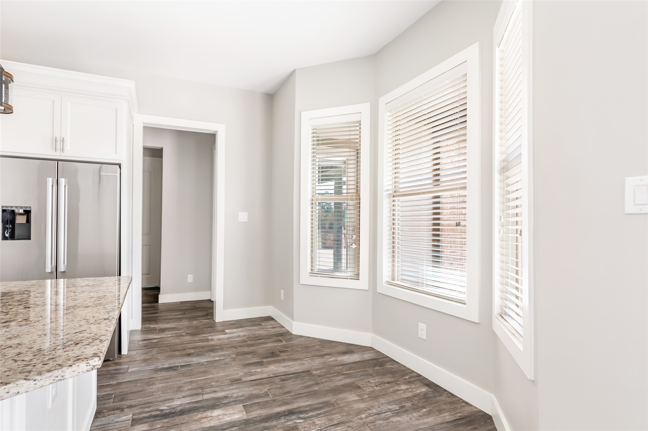 9006 Water Buck Lane Conroe, TX 77303 - Photo 35 of 48 a view of an empty room with wooden floor and a window