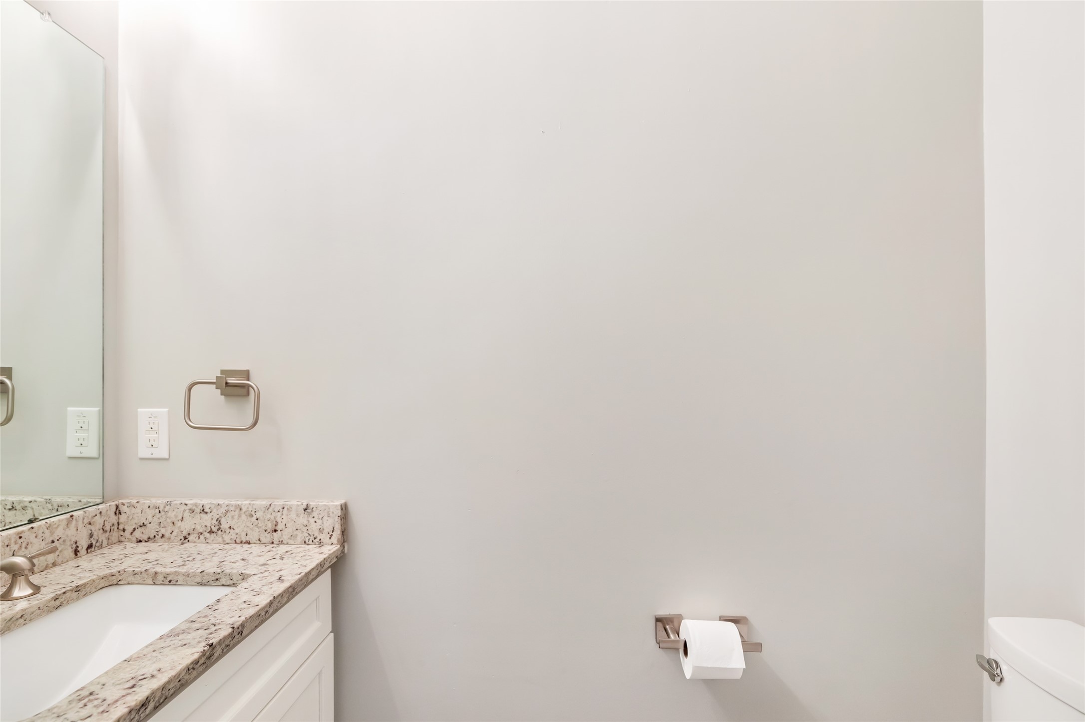 9006 Water Buck Lane Conroe, TX 77303 - Photo 39 of 48 a bathroom with a granite countertop sink and mirror