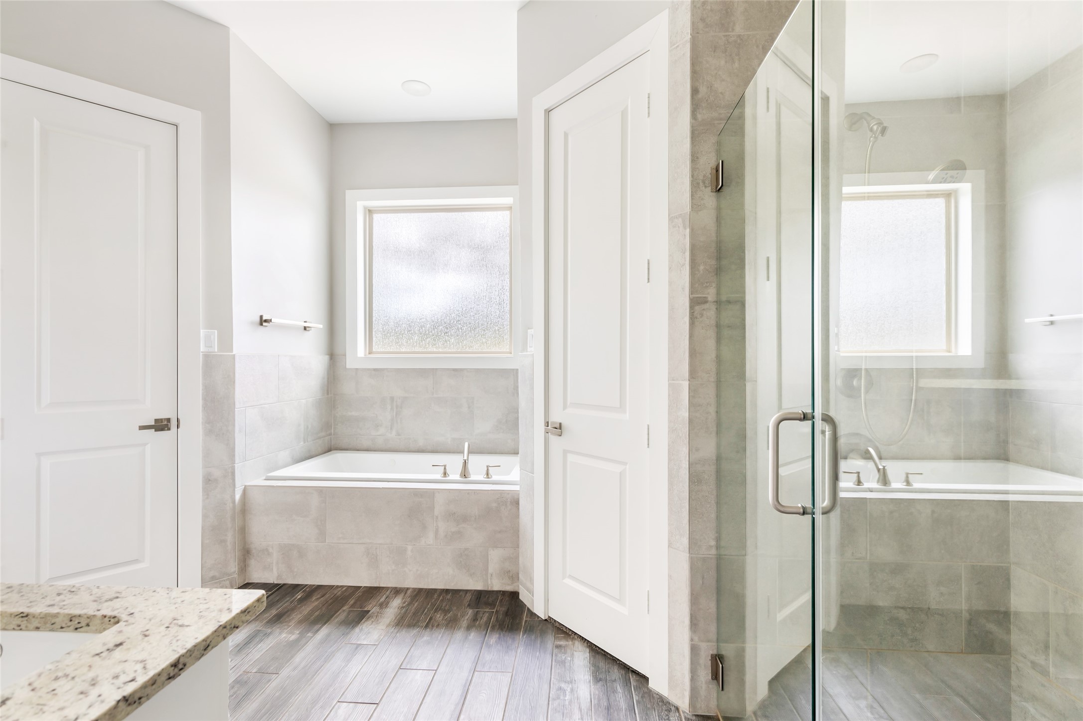 9006 Water Buck Lane Conroe, TX 77303 - Photo 42 of 48 a bathroom with a bathtub and a shower